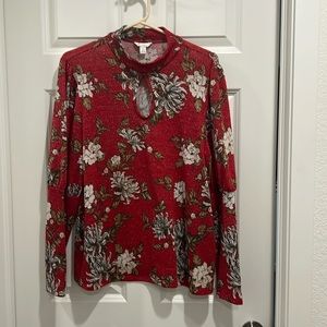 Est 1946 Red sweater with floral pattern.
